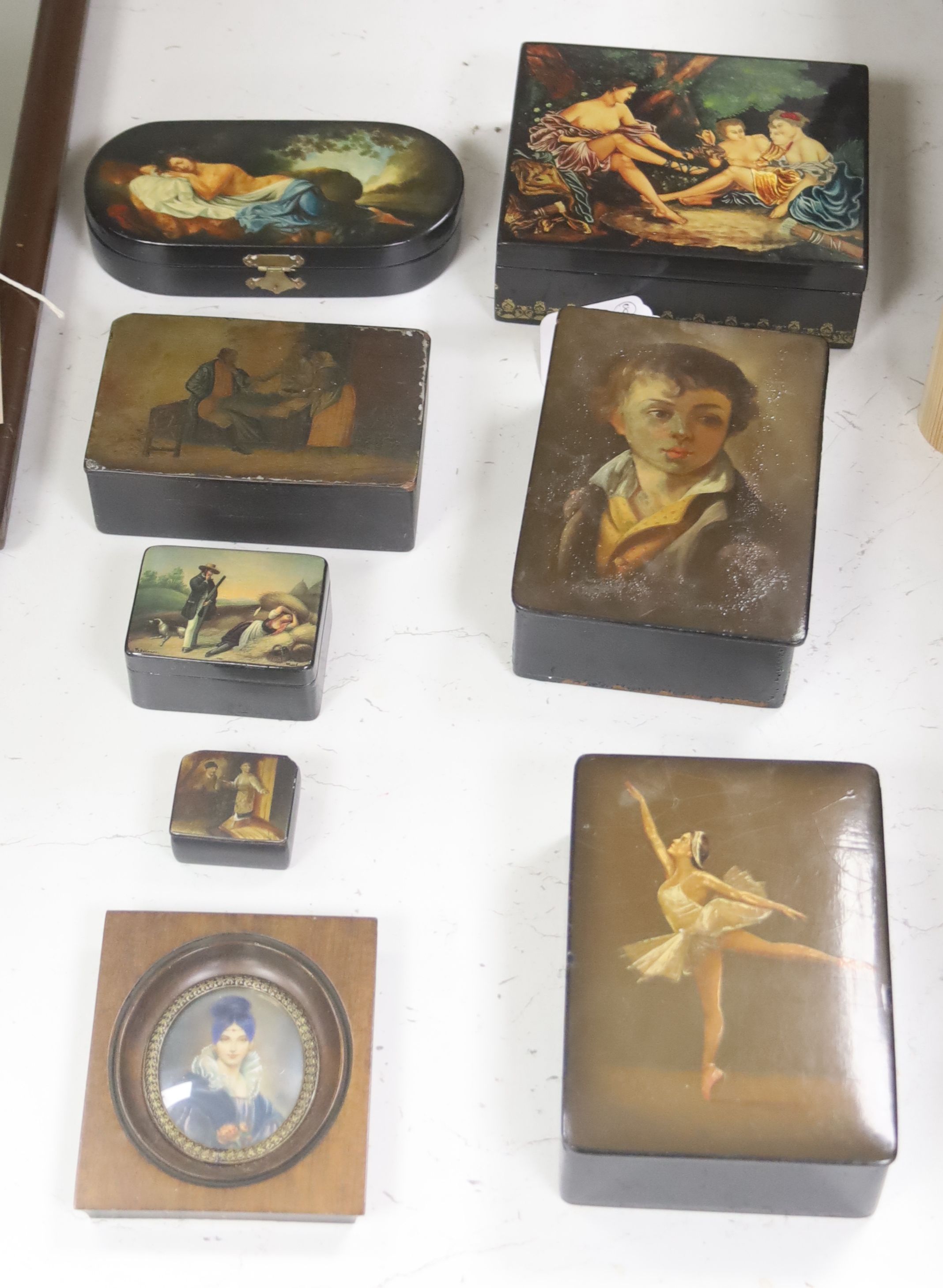 Seven Russian Papier mache boxes, 19th/20th century, large is 16.5 cm wide, with various painted scenes and a portrait miniature